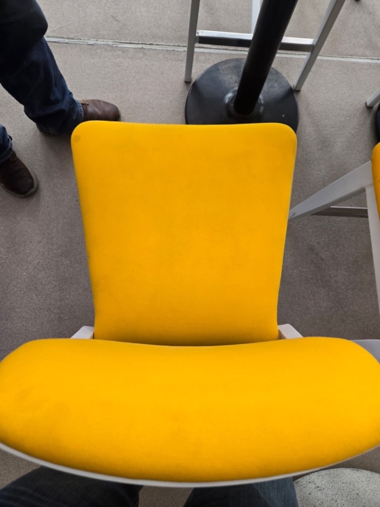 Yellow chair after cleaning — vibrant, stain-free fabric restored