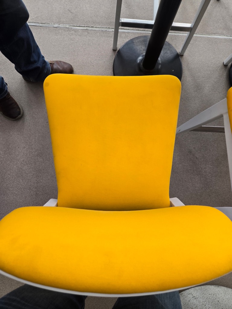 Yellow chair after cleaning — vibrant, stain-free fabric restored